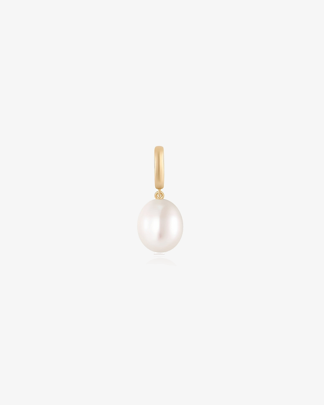 Freshwater pearl drop charm in 14k solid gold on a light grey background