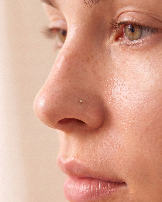 CZ Nose Ring in 14k solid gold, worn on the nose