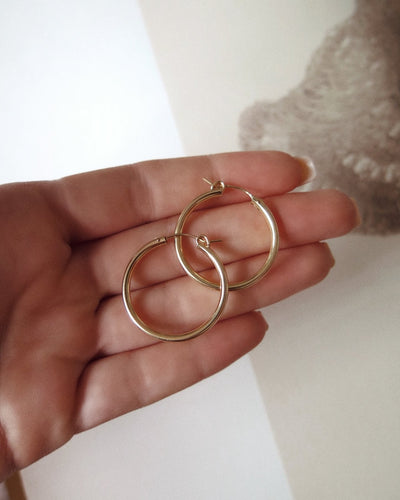 Large Thick Hoop Earrings - 14k Gold-Filled - 29mm pair held in hand | The Littl