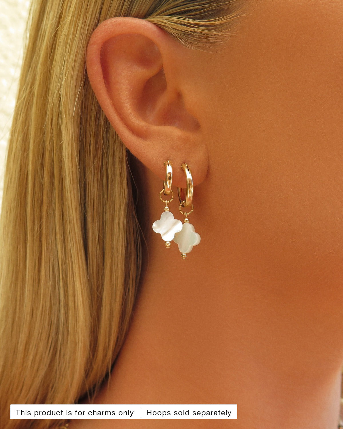 Mother of Pearl Clover Hoop Earring Charms worn on gold Thick Hoop Earrings in an ear stack | The Littl