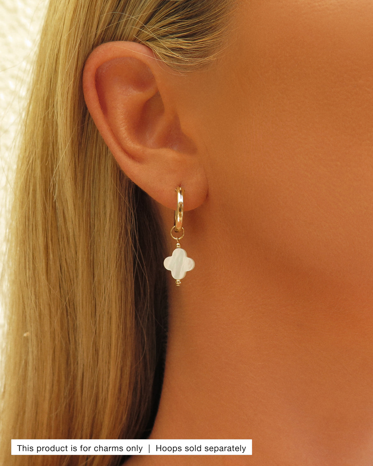 Model wearing a Mother of Pearl Clover Hoop Earring Charm on a gold Thick Hoop Earring | The Littl