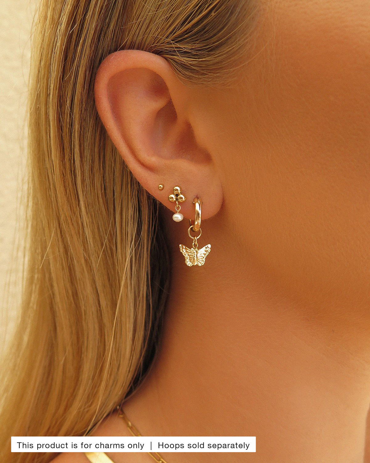 Butterfly Hoop Earring Charm styled in a gold ear stack | The Littl