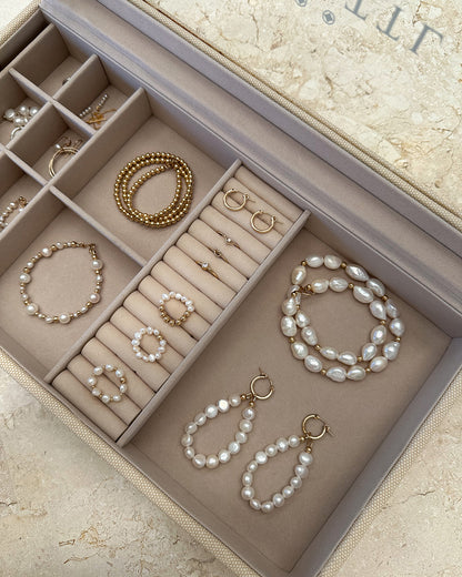 Deluxe Jewellery Box compartments holding pearl bracelets and gold hoops | The Littl