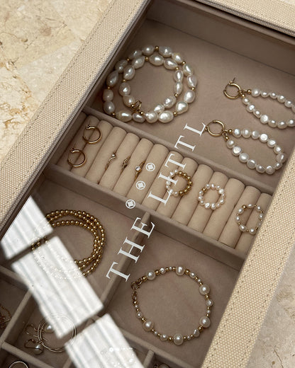 Deluxe Jewellery Box on travertine with pearl bracelets and gold rings inside | The Littl