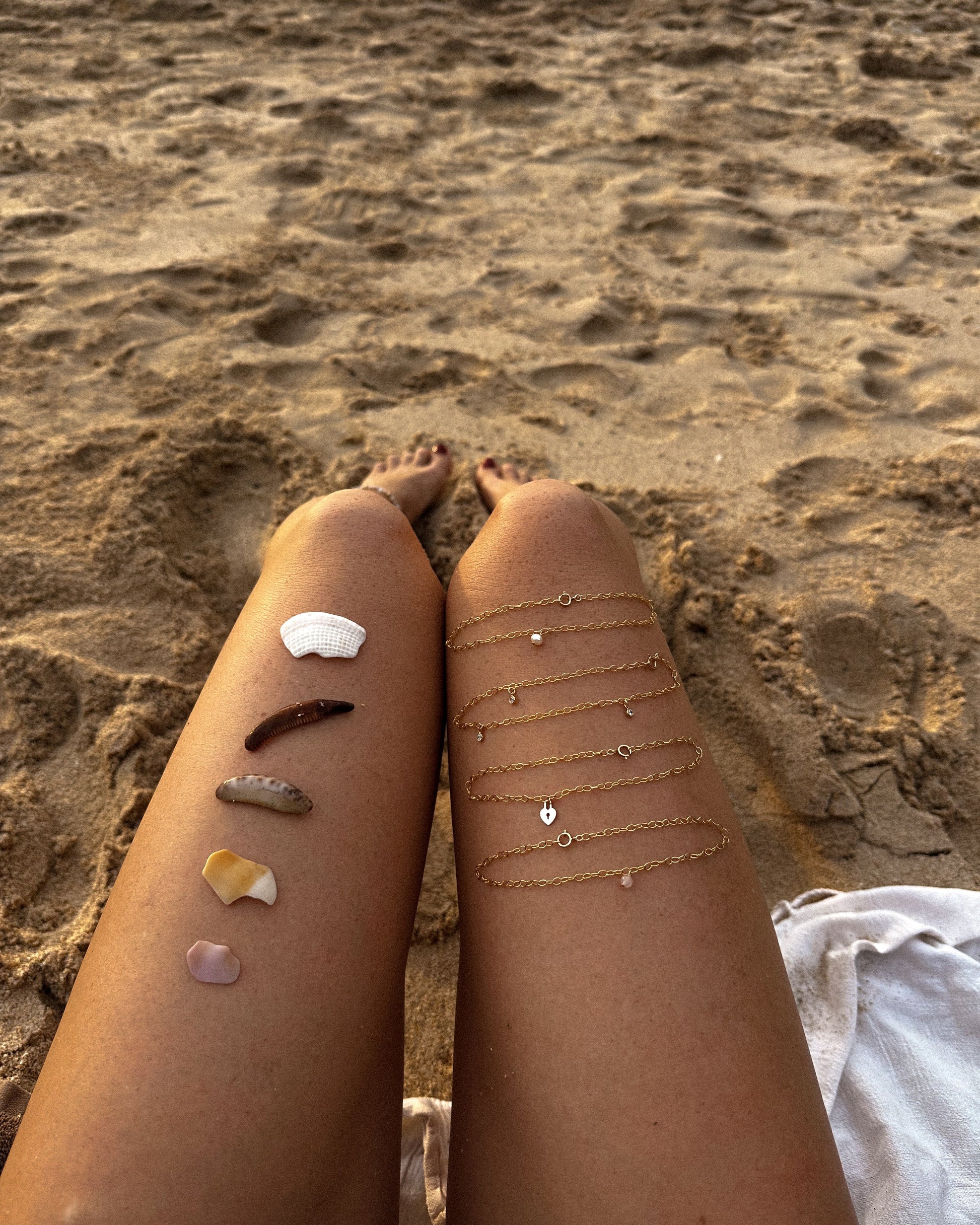 The Littl 14k gold-filled anklet collection styled together