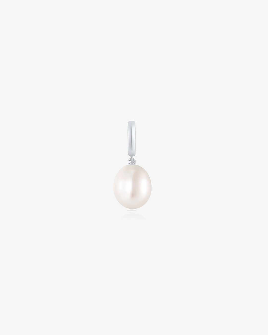 Freshwater pearl drop charm in 14k solid white gold on a light grey background