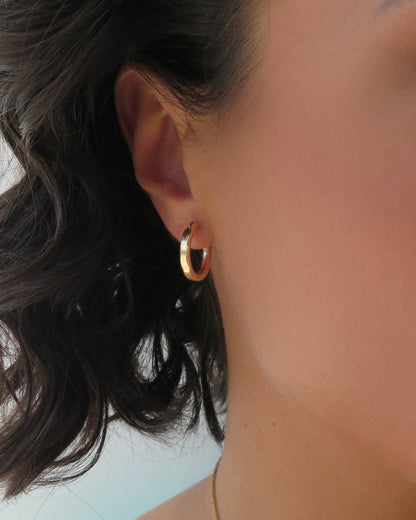 Small Thick Hoop Earrings in 14k yellow gold fill, worn with hair swept back | The Littl
