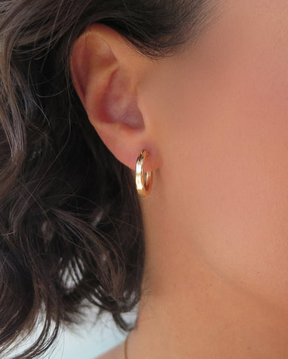 Small Thick Hoop Earrings in 14k yellow gold fill, side profile on the ear | The Littl