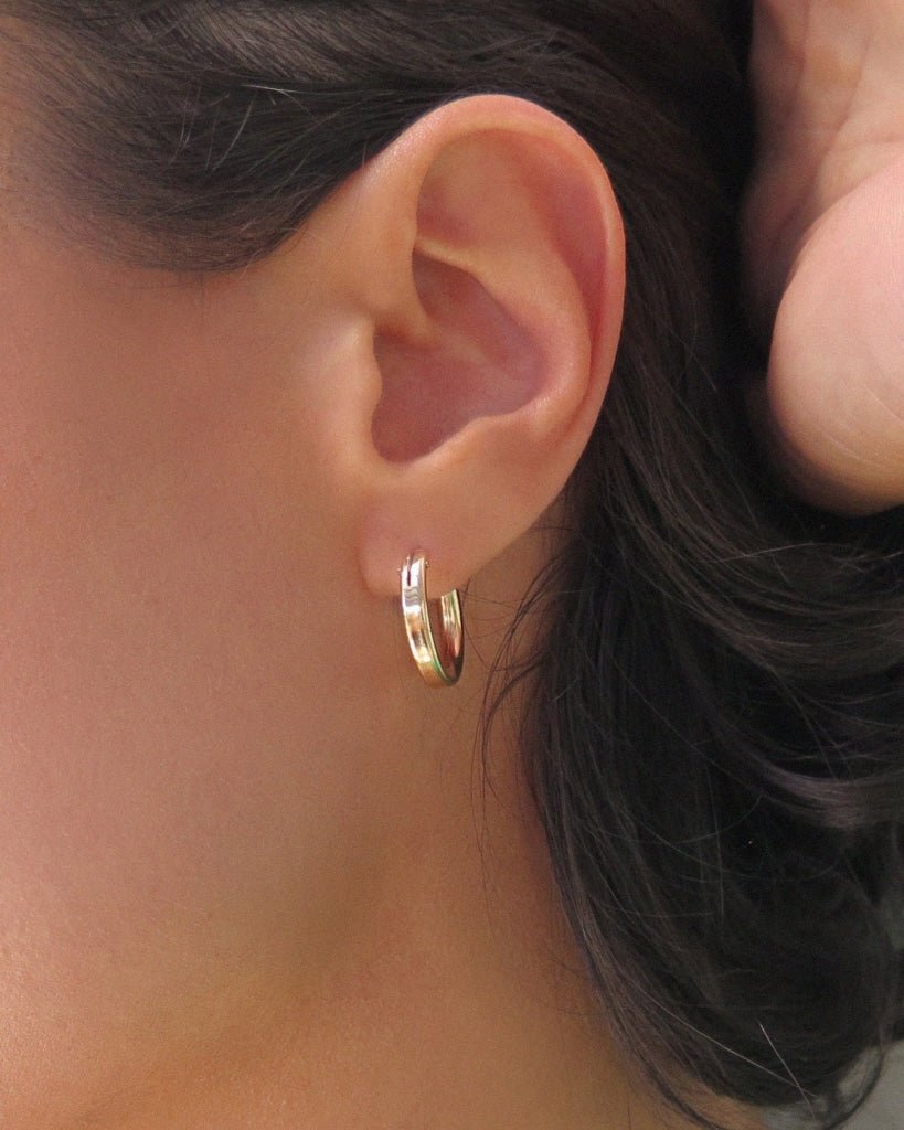 Small Thick Hoop Earrings in 14k yellow gold fill, worn close on the earlobe | The Littl