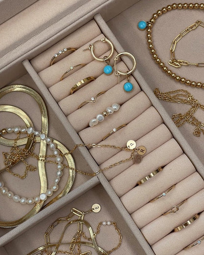 Close-up of Deluxe Jewellery Box compartments with rings, hoops and gold chains | The Littl